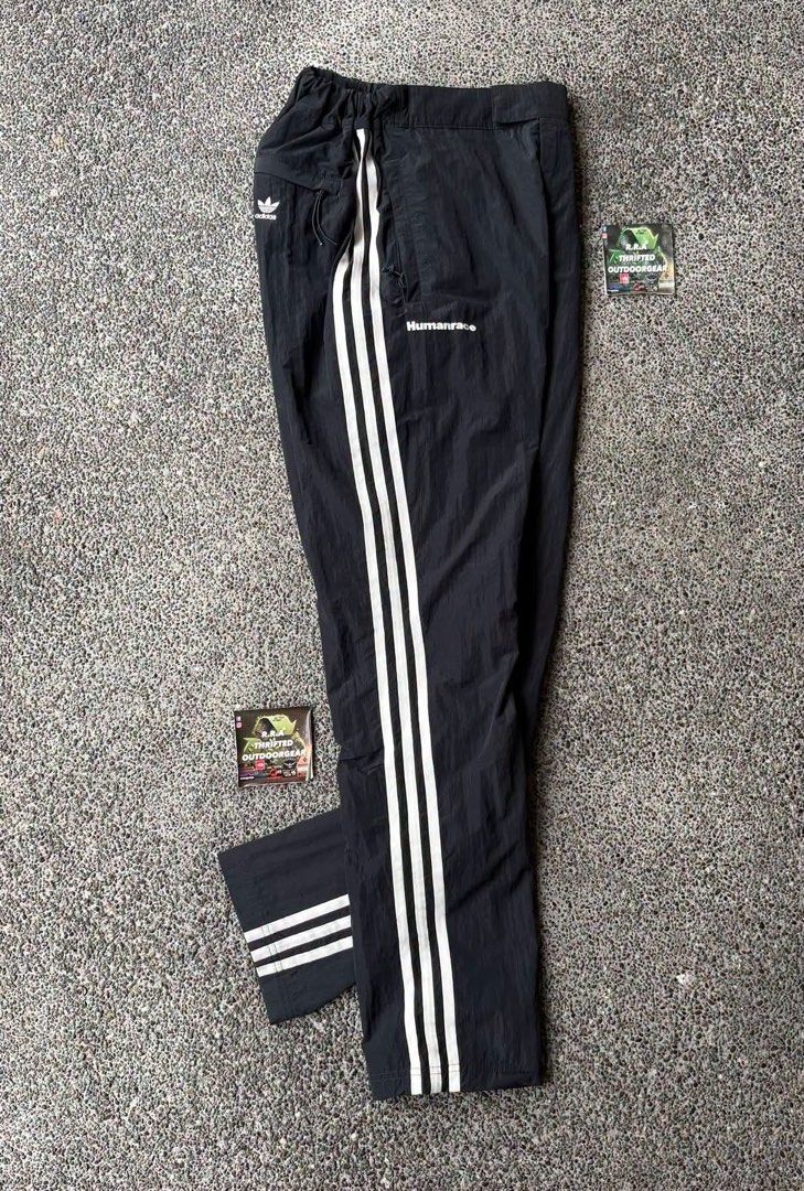 Adidas Human Race x Pharrell Williams (Category: Trousers) located in Caloocan City. Submitted by rjlthrifts (Listing ID 1461272186, Image 1). Description: Adidas Human Race x Pharrell Williams Excellent Condition Color Rate 10/10 24 - 26 Waist Line 40 Length No Issue. Price. 1,880 Loc. South Caloocan Courier. J&T And Flash Express.
