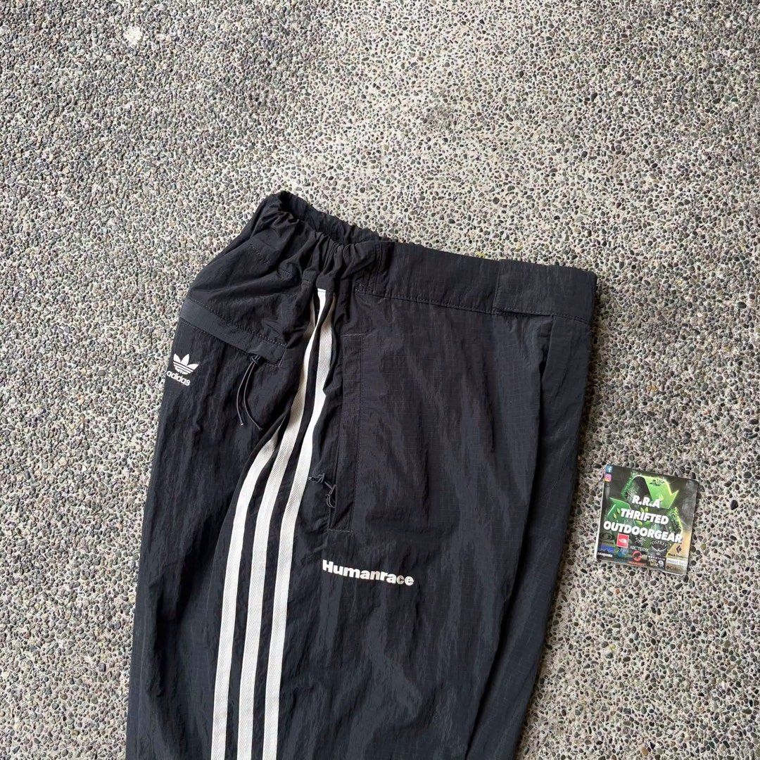 Adidas Human Race x Pharrell Williams (Category: Trousers) located in Caloocan City. Submitted by rjlthrifts (Listing ID 1461272186, Image 2). Description: Adidas Human Race x Pharrell Williams Excellent Condition Color Rate 10/10 24 - 26 Waist Line 40 Length No Issue. Price. 1,880 Loc. South Caloocan Courier. J&T And Flash Express.