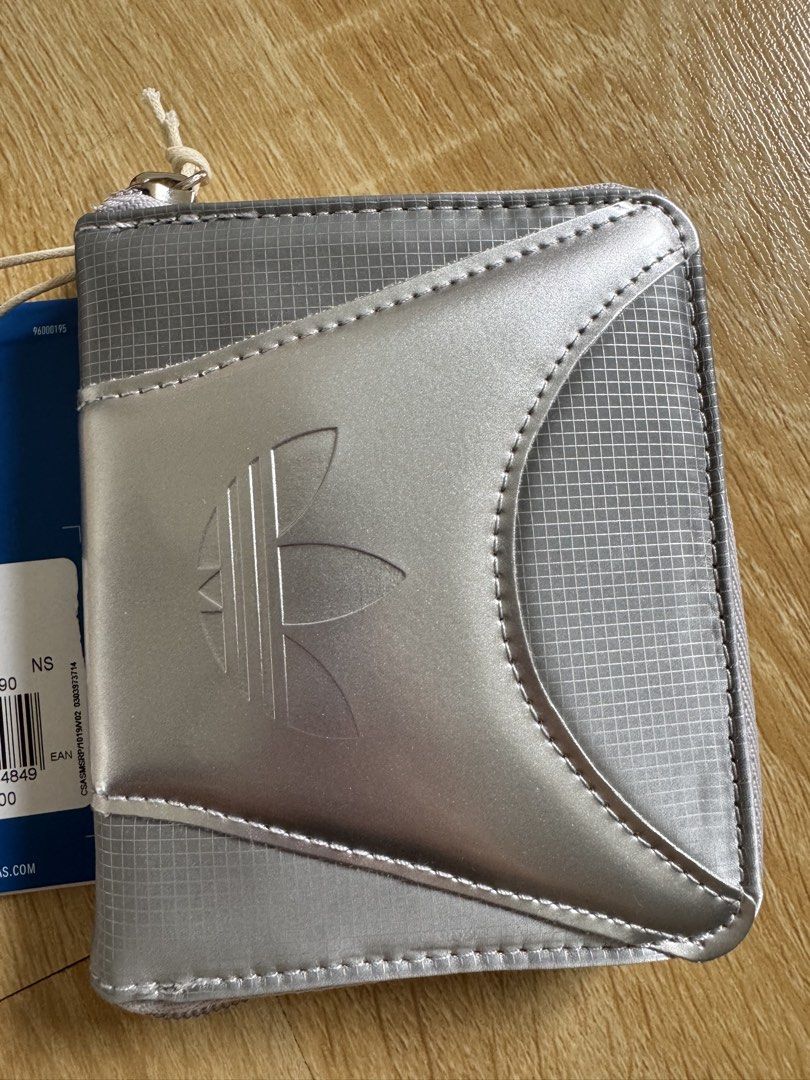 Adidas Neck Pouch Silver Metallic JX5177 (Category: Purses & Pouches) located in Manila. Submitted by helloseptembermnl (Listing ID 1461130001, Image 3). Description: - Brand: Adidas - Model: JX5177 - Color: Silver Metallic - Condition: Brand new with original tag - Features: Zip closure, ideal for carrying essentials - Design: Clean and minimalist.