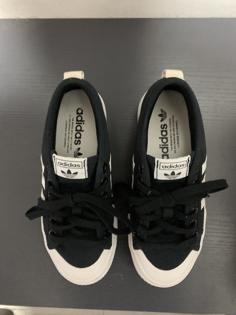 Adidas Nizza Platform Shoes Black White (Category: Sneakers) located in Makati City. Submitted by sadsigh (Listing ID 1461247233, Image 2). Description: - Classic Adidas Nizza platform sneakers - Black canvas with iconic white stripes - White sole - Lace-up closure for a secure fit - Comfortable and stylish for everyday wear - Perfect for elevating casual outfits.