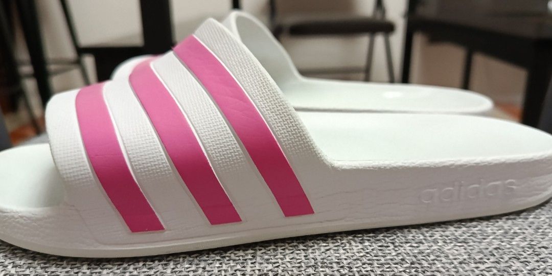 Adidas slides (Category: Slippers and slides) located in Quezon City. Submitted by brand_dyn3 (Listing ID 1461261659, Image 2). Description: Adidas Slides this item is used pero I still have one more same size, same color and design brand new/not used. this was bought in America 🇺🇸.