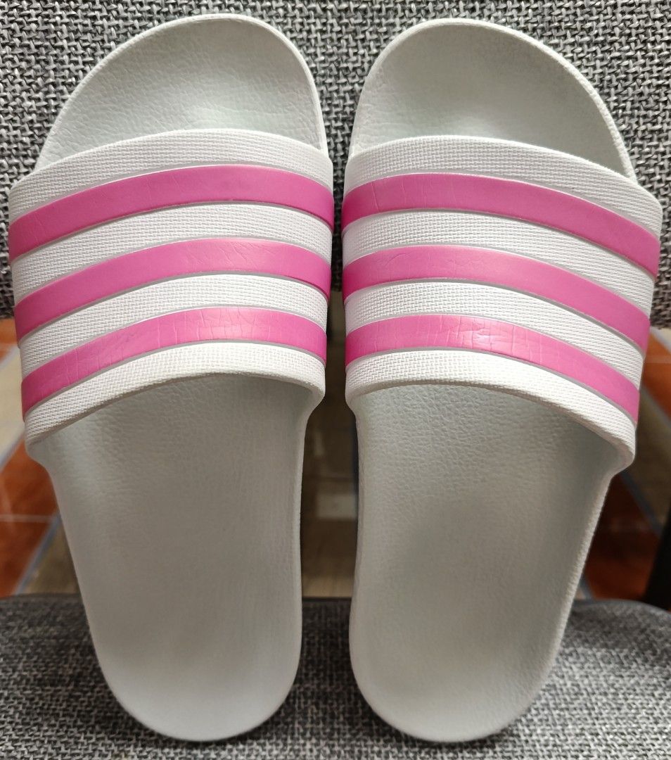 Adidas slides (Category: Slippers and slides) located in Quezon City. Submitted by brand_dyn3 (Listing ID 1461261659, Image 1). Description: Adidas Slides this item is used pero I still have one more same size, same color and design brand new/not used. this was bought in America 🇺🇸.