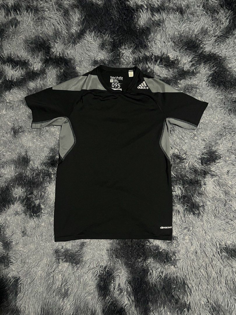 Adidas Techfit 095 Black Shirt (Category: Activewear) located in Cebu City. Submitted by drip_block (Listing ID 1461234565, Image 1). Description: Size M - Adidas Techfit shirt - Color: Black with grey shoulder/sleeve accents - Material: Polyester and elastane blend (check tag for specifics) - Fit: Comfortable, designed for performance - Ideal for: Workouts, sports, or casual wear.