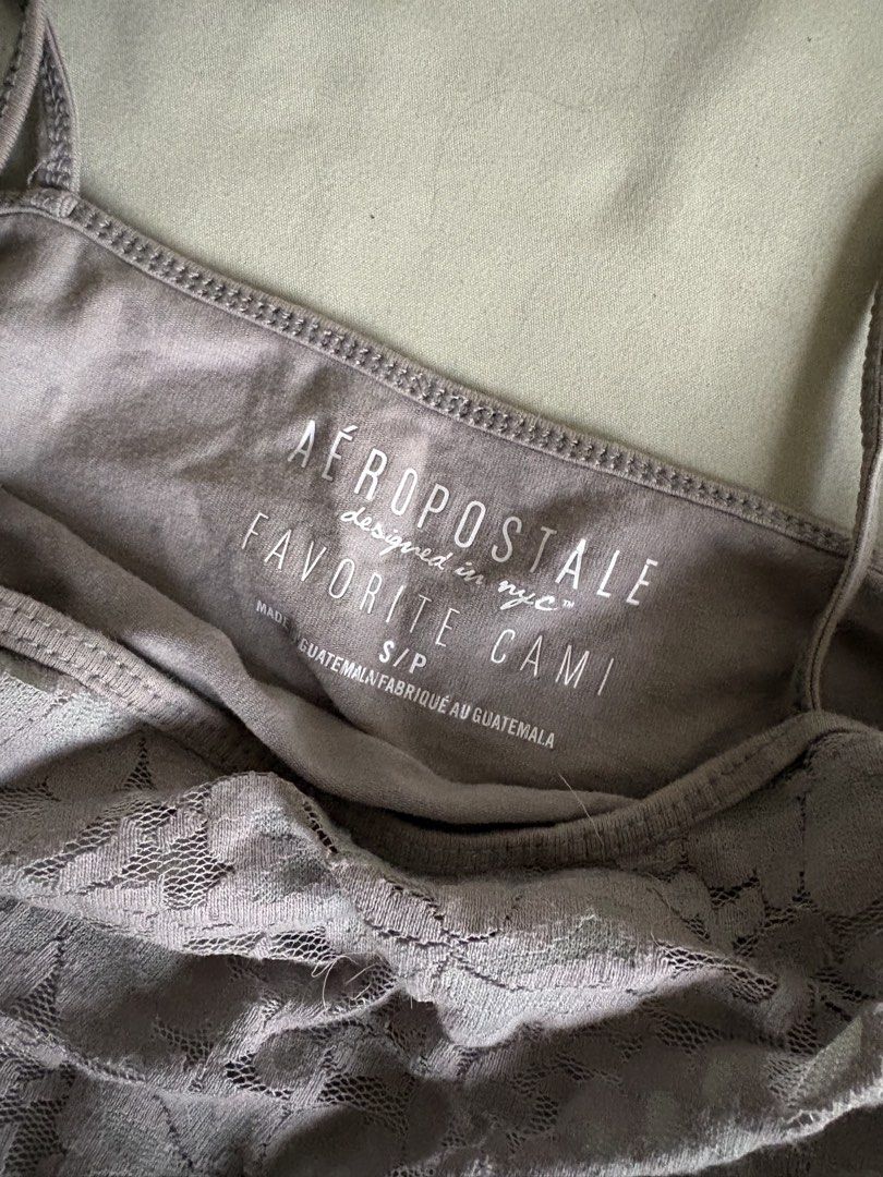 Aeropostale Grey Lace Cami Top S/P (Category: Sleeveless) located in Legazpi City. Submitted by satowa00 (Listing ID 1461269332, Image 3). Description: - Grey Aeropostale cami top - Features a delicate lace overlay - Adjustable straps for a perfect fit - Size: S/P (Small/Petite) - Made in Guatemala - Versatile: great for layering or wearing on its own.