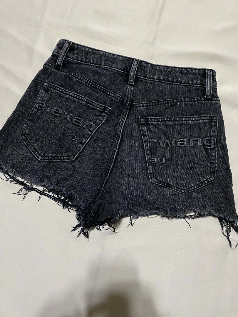 Alexander Wang Denim Shorts sz28 (Category: Shorts) located in Taguig. Submitted by althriftdailyloots94 (Listing ID 1461263047, Image 1). Description: - Brand: Alexander Wang size 28 - Color: Black - Style: High-rise denim shorts - Features: Distressed hemline, embossed brand logo on back pockets - Versatility: Perfect staple piece for any outfit.
