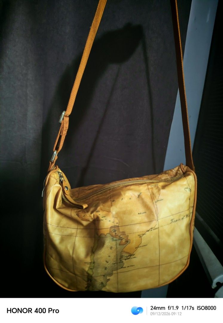 Alviero Martini Shoulder Bag - Map Print (Category: Luxury Bags & Wallets) located in Manila. Submitted by cleverwhale_45b7bc (Listing ID 1461181774, Image 3). Description: - Cool shoulder bag with a vintage map print - Tan strap with "1A Classe" text - Secure zipper closure - Made in Bulgaria - Ideal for travel or everyday use - Unique and stylish design.