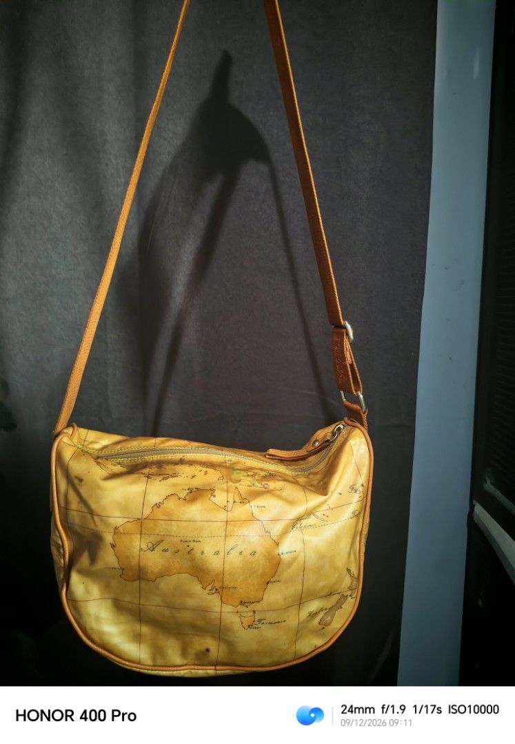 Alviero Martini Shoulder Bag - Map Print (Category: Luxury Bags & Wallets) located in Manila. Submitted by cleverwhale_45b7bc (Listing ID 1461181774, Image 1). Description: - Cool shoulder bag with a vintage map print - Tan strap with "1A Classe" text - Secure zipper closure - Made in Bulgaria - Ideal for travel or everyday use - Unique and stylish design.
