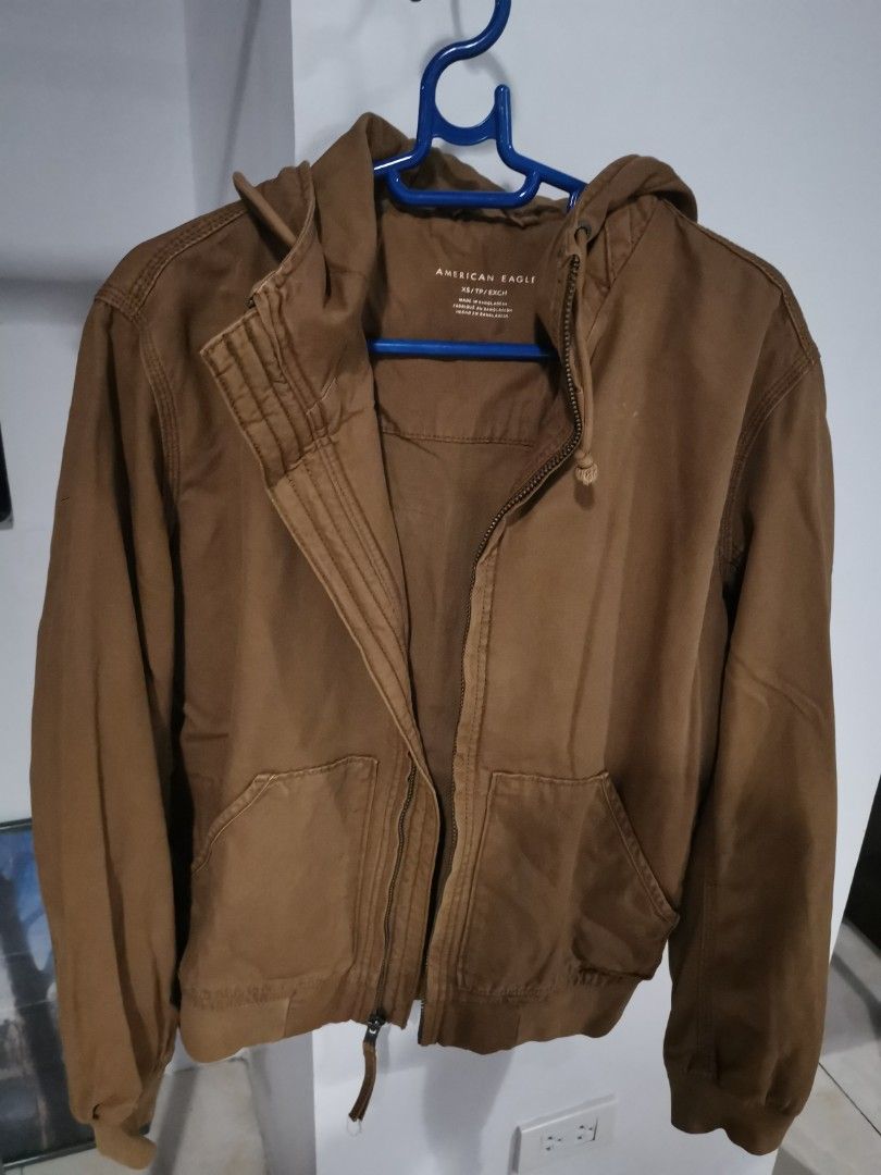AmericanEagle Brown Utility Jacket with Zipper Pockets (Category: Coats, Jackets and Outerwear) located in Manila. Submitted by hb1118 (Listing ID 1461281973, Image 1). Description: - Brown utility jacket - Zipper pockets on the sides - Ribbed cuffs and hem - Ideal for casual wear - fits like a small to medium - used less than 5 times - purchased in American Eagle Yokohama.