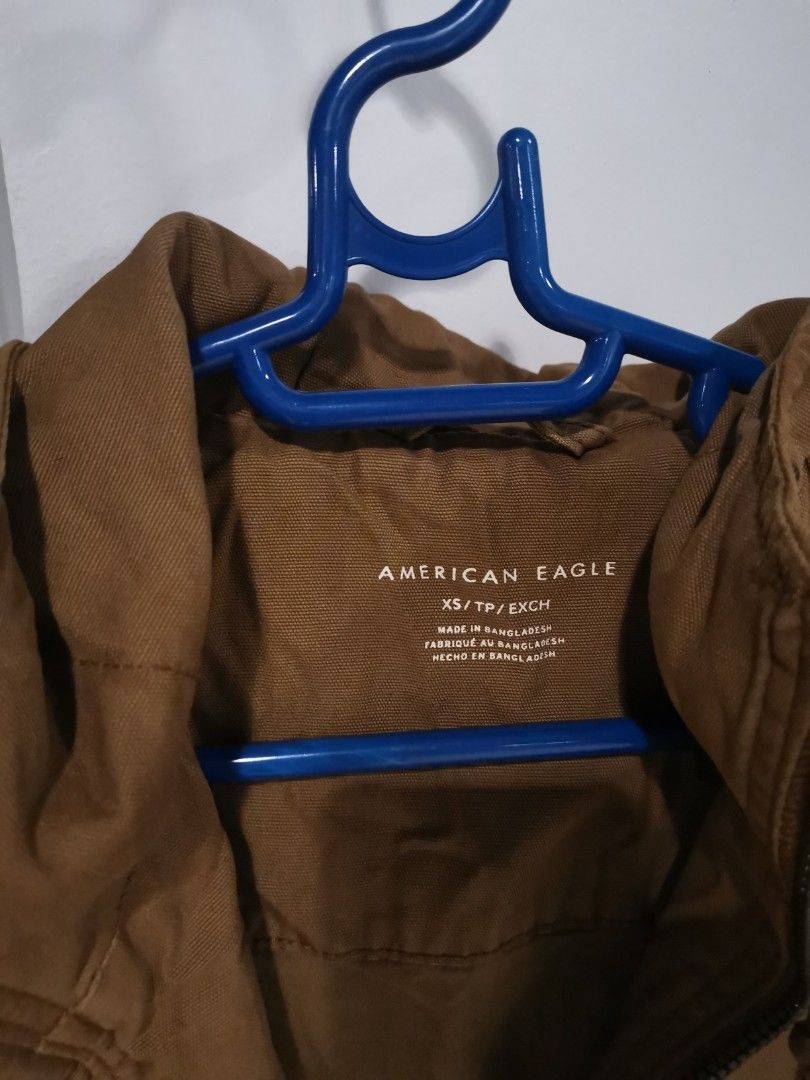 AmericanEagle Brown Utility Jacket with Zipper Pockets (Category: Coats, Jackets and Outerwear) located in Manila. Submitted by hb1118 (Listing ID 1461281973, Image 2). Description: - Brown utility jacket - Zipper pockets on the sides - Ribbed cuffs and hem - Ideal for casual wear - fits like a small to medium - used less than 5 times - purchased in American Eagle Yokohama.