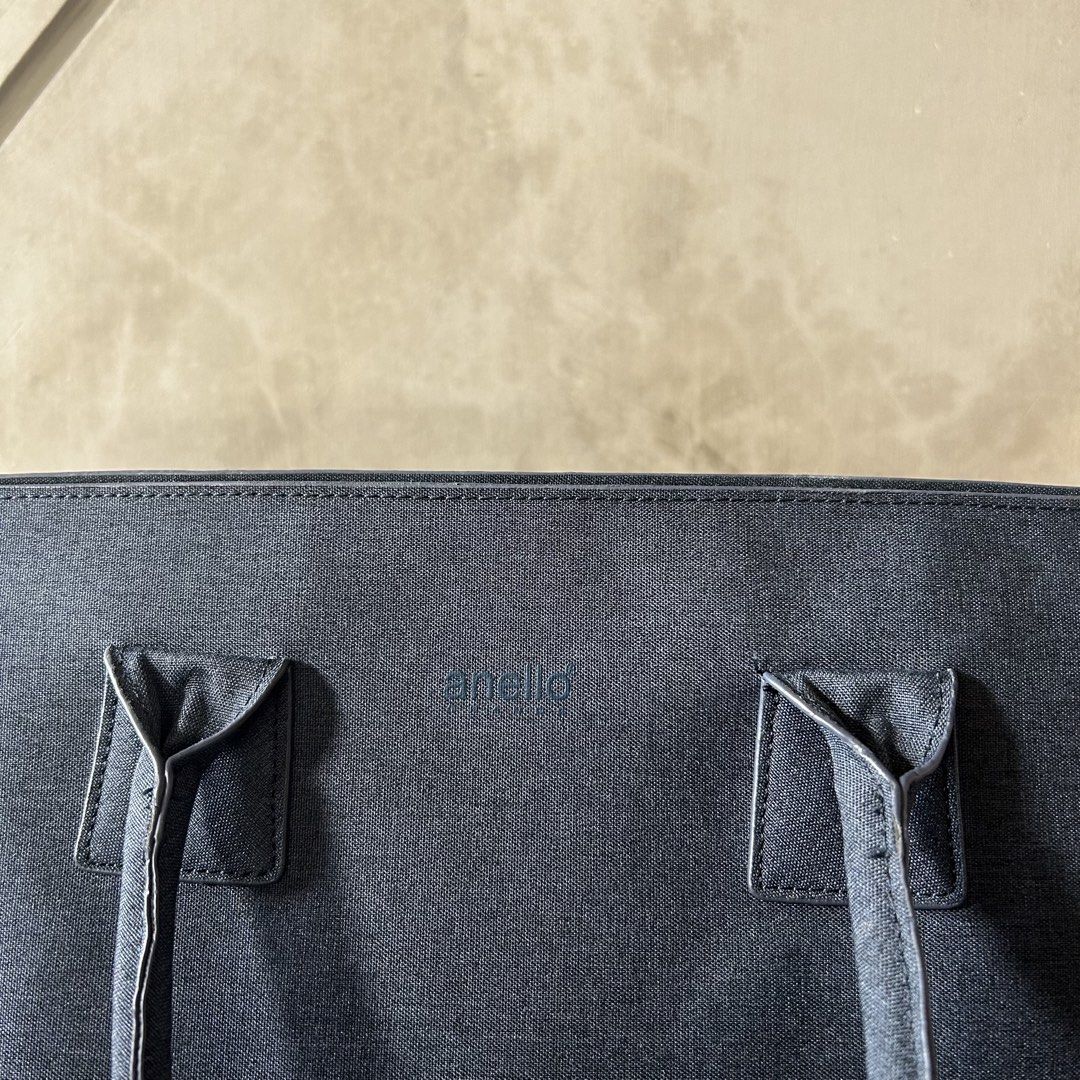 Anello Grande Pino Tote Bag (Category: Tote Bags) located in Ramos. Submitted by morefindss (Listing ID 1461209705, Image 2). Description: Anello Grande Pino Tote Bag in Navy - Can fit 13” laptop and an A4 file case - Dimensions: 32x27x11.5cm - Price Negotiable for sure buyers as long as no lowballing - Rarely Used since I have too many school bags.
