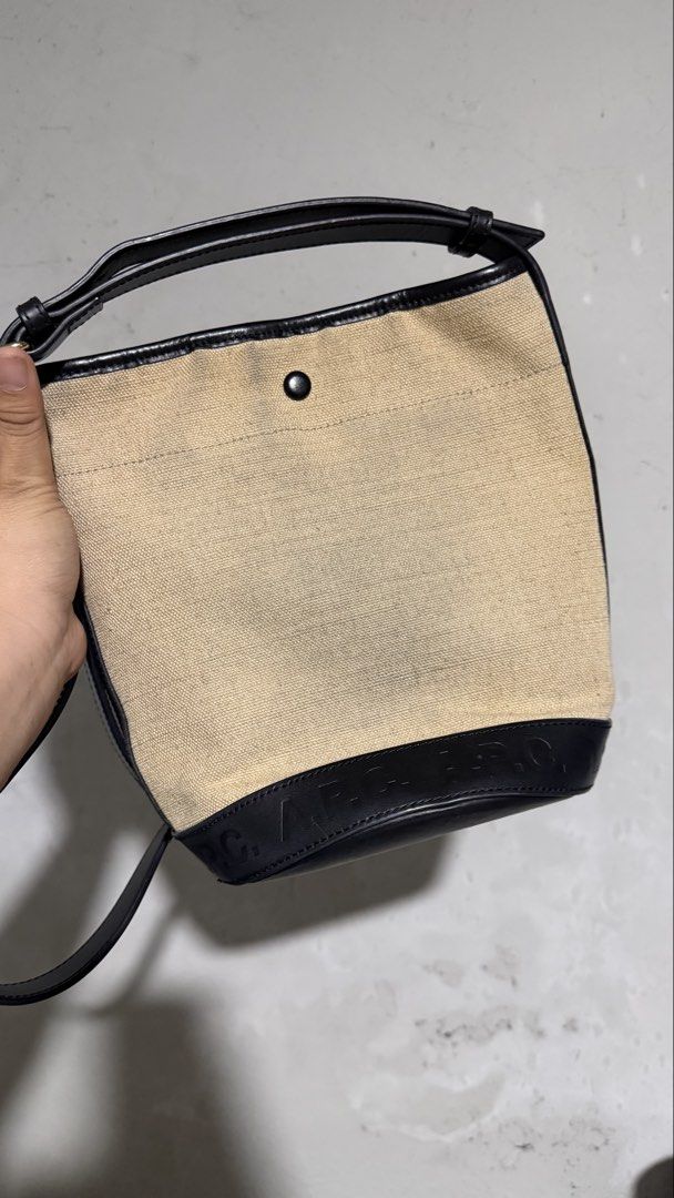 APC Helene canvas bucket bag (Category: Luxury Bags & Wallets) located in Pasig City. Submitted by hello_jello. (Listing ID 1461152472, Image 3). Description: Original Has washable unnoticeable stain at the back Verygood condition Leather and hardware part is in good condition as well Price nego .