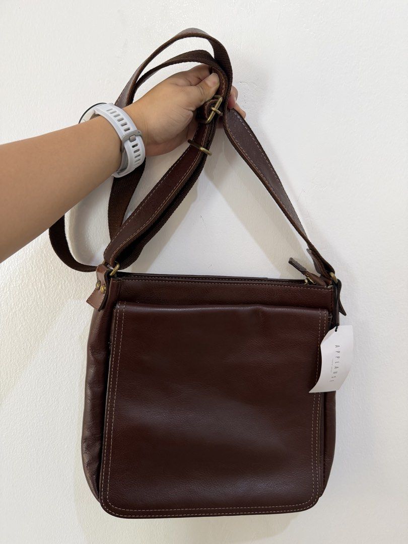 Applause Leather Crossbody Bag (Category: Sling Bags) located in Manila. Submitted by escarchame98247 (Listing ID 1461162005, Image 1). Description: - Brand: Applause (Japan) - Type: Leather Crossbody Bag / Sling Bag - Color: Dark Brown - Material: Genuine Leather - Condition: Good, pre-loved - Style: Versatile and practical for daily use.