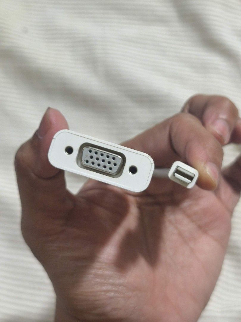 Apple Mini DisplayPort to VGA Adapter (Model A1307) (Category: Cables & Adaptors) located in Taguig. Submitted by juliestjuly (Listing ID 1461159739, Image 3). Description: The Input: A male Mini DisplayPort connector (also fully compatible with Thunderbolt 1 and Thunderbolt 2 ports found on legacy Macs). The Output: A female 15-pin VGA port used to mirror or extend your screen onto a standard analog monitor, projector, or older LCD display. Perf