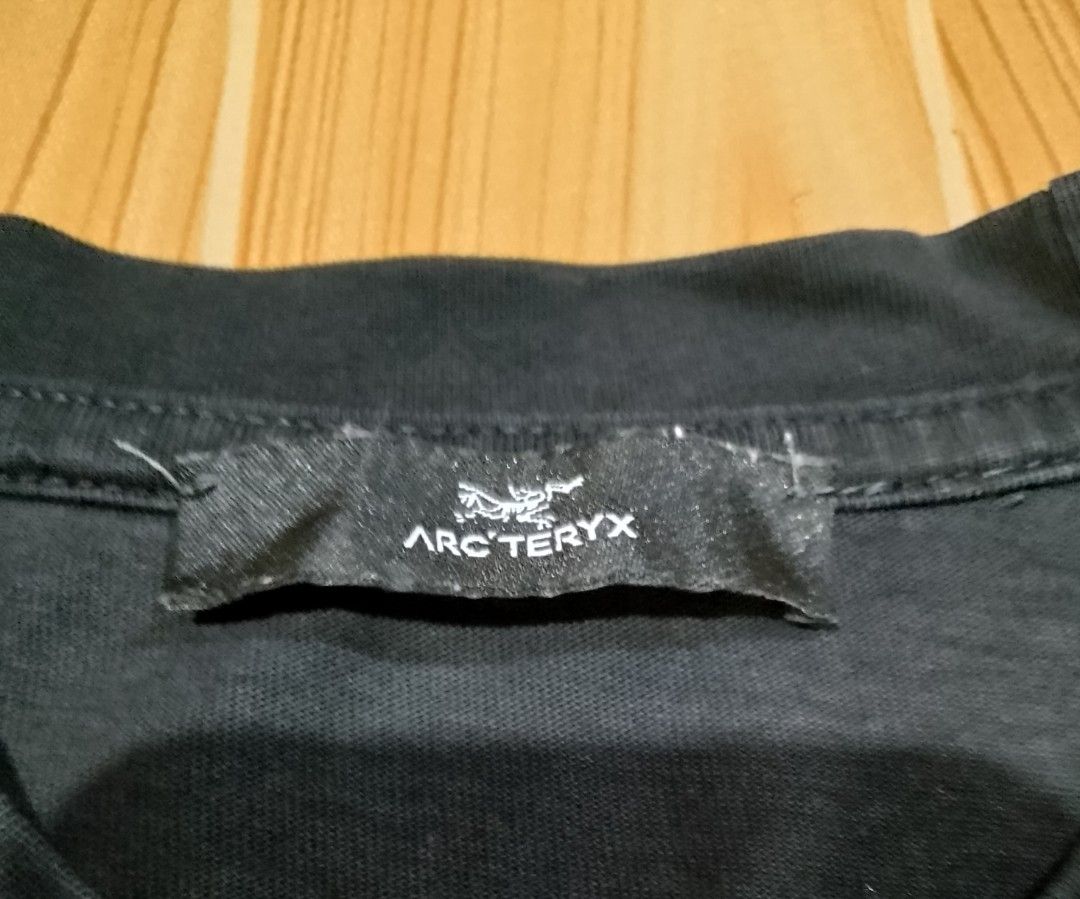 Arc'teryx Black T-shirt (Category: Tshirts & Polo Shirts ) located in San Jose del Monte. Submitted by azetor (Listing ID 1461150611, Image 3). Description: - Brand: Arc'teryx - Color: Black - Size: Medium (M) - Features: Iconic logo on front - Material: Made in China - Best for: Casual wear, outdoor activities - Condition: Please check photos for details - measurements - chest 19 - length 27 - color rate 9.5/10 - great condition .