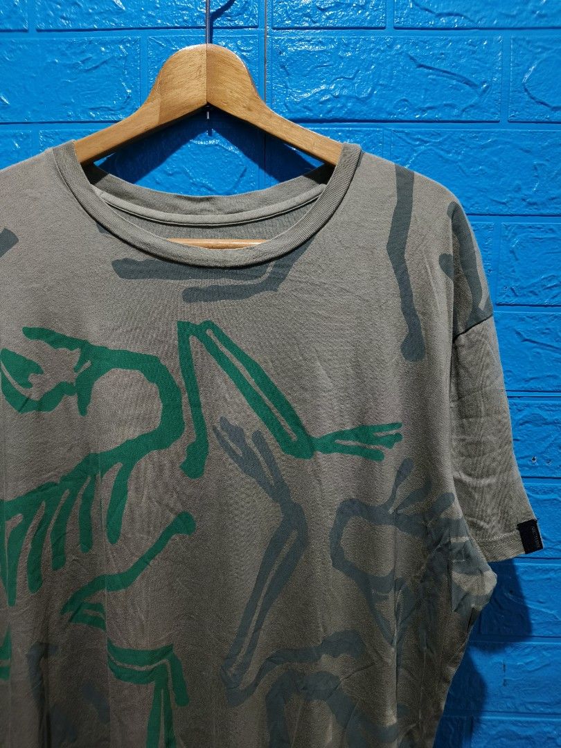 Arc'teryx T-shirt XL Dinosaur Bone Graphic (Category: Tshirts & Polo Shirts ) located in Davao. Submitted by vndrgd (Listing ID 1461116421, Image 2). Description: - Brand: Arc'teryx - Color: Grey - Graphic: Dinosaur bone print (green & grey) - Size: XL - Measurements: Width 24", Length 31" - Material: 100% Cotton - Style: Casual wear.