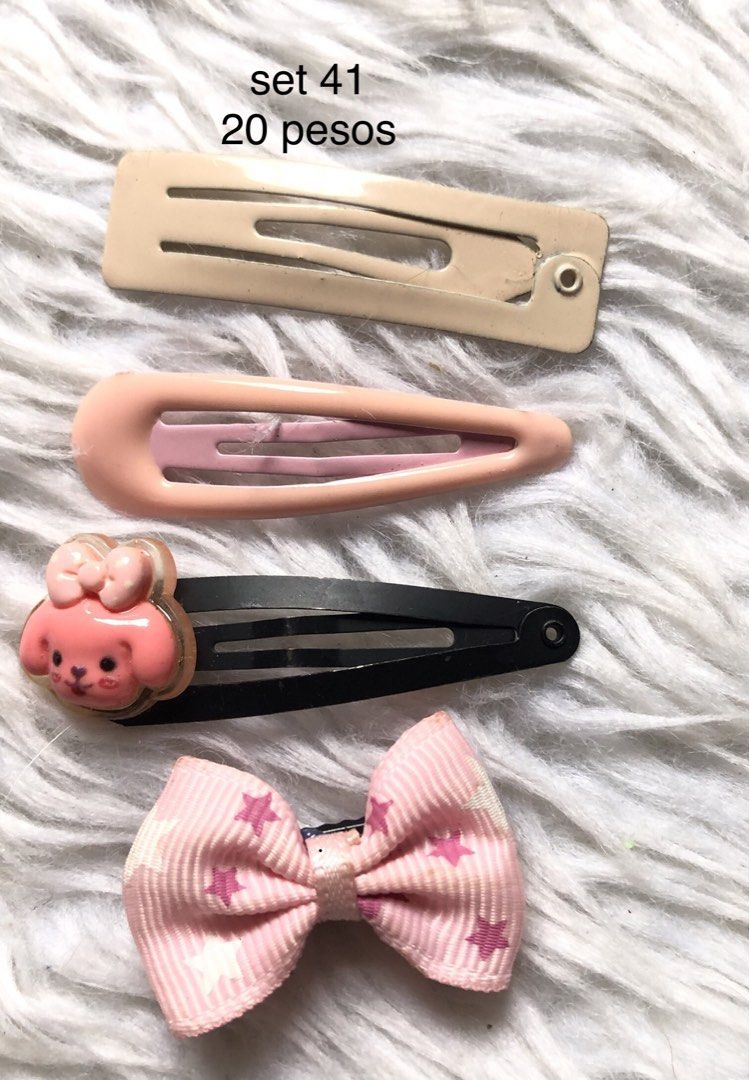 Assorted Hair Clips Sets - 20 Pesos Each (Category: Hair Accessories) located in Taguig. Submitted by nikikaystuff (Listing ID 1461318960, Image 1). Description: - Assorted hair clip sets - 4 clips included per set - Available designs: Peppa Pig, teddy bear, plain, and glittery styles - Ideal for everyday use or for kids - Affordable price: P20 per set.