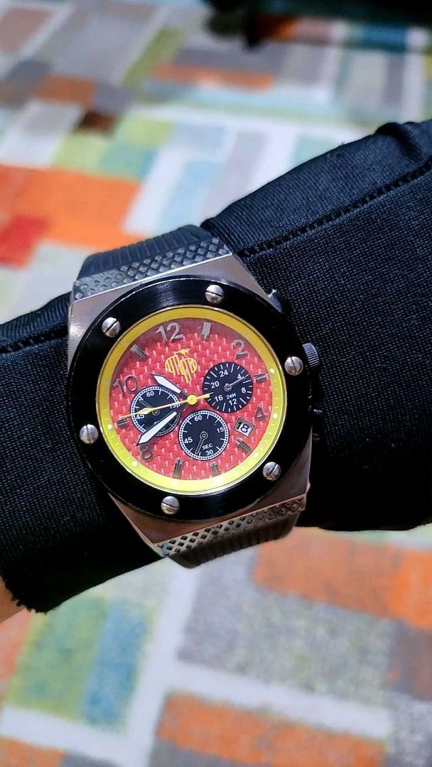 Aust- Phils Chronograph Watch with Red Dial and Yellow Bezel (Category: Luxury Watches) located in Baliuag. Submitted by marieannfernando23 (Listing ID 1461287135, Image 1). Description: - Men's Watch Cool chronograph watch - Red textured dial with yellow accents - Three subdials for stopwatch functions - Date window included - Black bezel with silver screws - Comes with a black strap - Ideal for everyday wear or collectors - Like new .