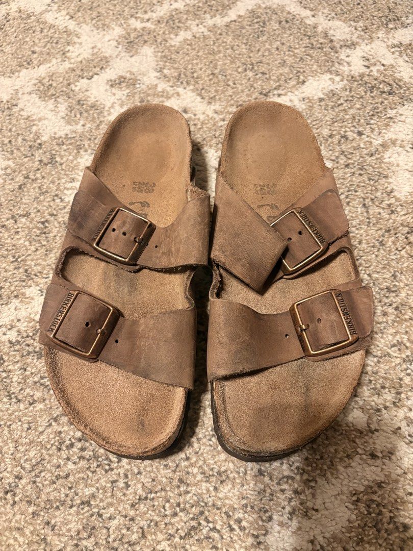 Auth Preloved Birkenstock Arizona (Category: Slippers and slides) located in Paranaque City. Submitted by silentstone.dolphin (Listing ID 1461295592, Image 1). Description: Oiled Leather Material.. Brass Buckle.. Brown Color.. Size 37N.. Super Nice in actual😍.
