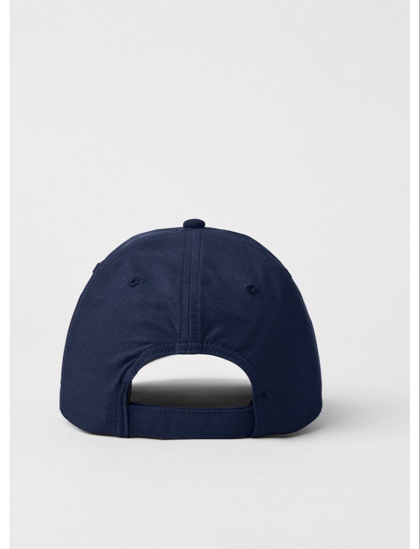 Authentic Alo Yoga Performance Off-Duty Cap - Navy (Category: Caps & Hats) located in Manila. Submitted by bl0ss0ms711 (Listing ID 1461301932, Image 3). Description: - Navy blue cap from Alo Yoga - Retails at USD68 - Features an embossed 'alo' logo on the front - Adjustable strap at the back for a customized fit - Ideal for everyday wear and workouts - Includes original packaging.