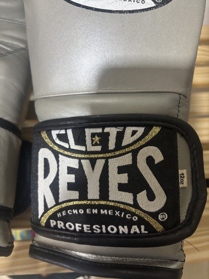 Authentic Cleto Reyes Boxing Gloves - Silver 12oz (Category: Combat Sports) located in Manila. Submitted by poulexsulit (Listing ID 1461252811, Image 3). Description: - Brand: Cleto Reyes - Size: 12oz - Color: Silver - Origin: Made in Mexico - Ideal for: Training and sparring - Condition: High-quality professional boxing gloves - Brand New is around 23k.