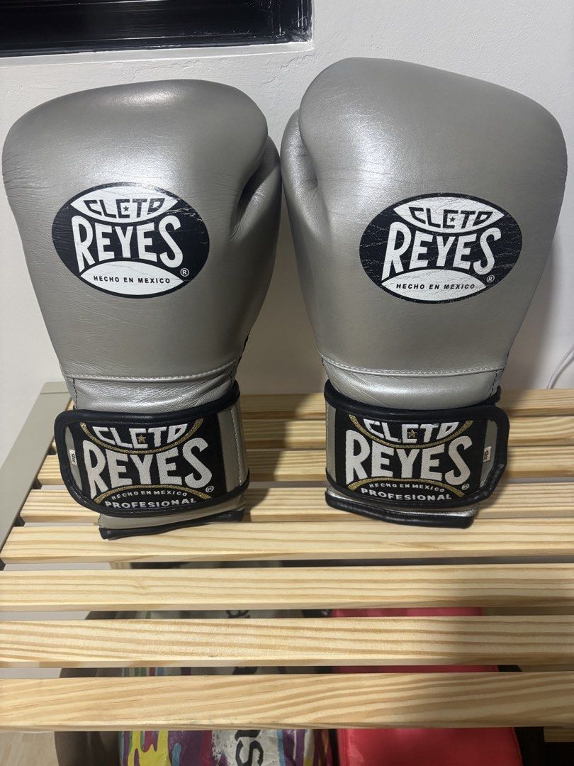 Authentic Cleto Reyes Boxing Gloves - Silver 12oz (Category: Combat Sports) located in Manila. Submitted by poulexsulit (Listing ID 1461252811, Image 1). Description: - Brand: Cleto Reyes - Size: 12oz - Color: Silver - Origin: Made in Mexico - Ideal for: Training and sparring - Condition: High-quality professional boxing gloves - Brand New is around 23k.