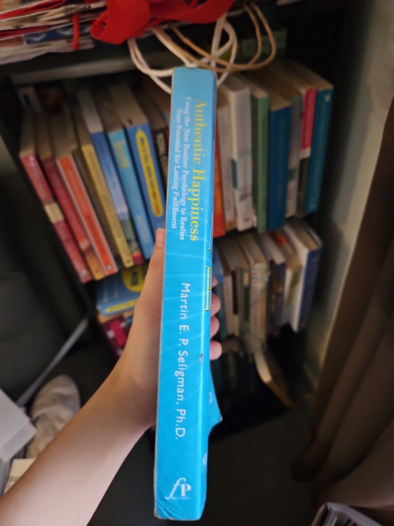 Authentic Happiness by Martin E. P. Seligman Book (Category: Storybooks) located in Manila. Submitted by preloved.christine (Listing ID 1461222999, Image 2). Description: - Book: Authentic Happiness by Martin E. P. Seligman - Explores positive psychology for lasting fulfillment - Some pages have green highlighting - Spine shows some wear - Ideal for those interested in happiness and well-being.