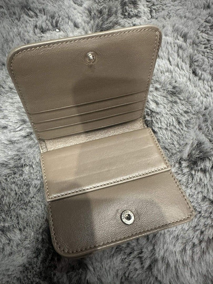Balenciaga Leather Bifold Wallet (Category: Luxury Bags & Wallets) located in Mandaluyong City. Submitted by calibre915 (Listing ID 1461153993, Image 2). Description: - Authentic Balenciaga bifold wallet - Chic taupe leather - Multiple card slots for organization - Secure coin pocket with snap closure - Subtle embossed Balenciaga logo on the front - Immaculate interior condition - Ideal for everyday essentials.