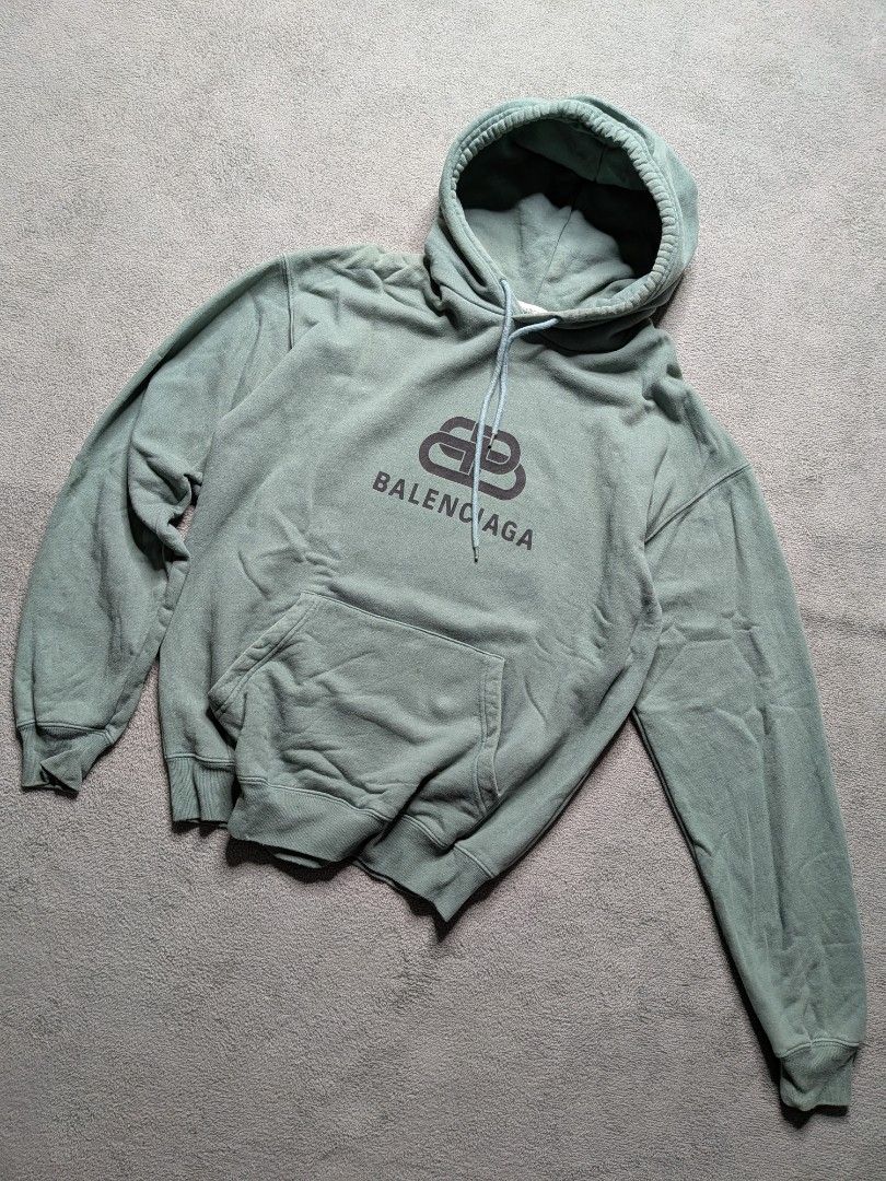 Balenciaga Script Hoodie (Category: Hoodies) located in Paniqui. Submitted by fndrs.kprs.ph (Listing ID 1461120229, Image 1). Description: Balenciaga Size on tag: XS 22x27 Color rate: 9/10 Good Condition No flaws.