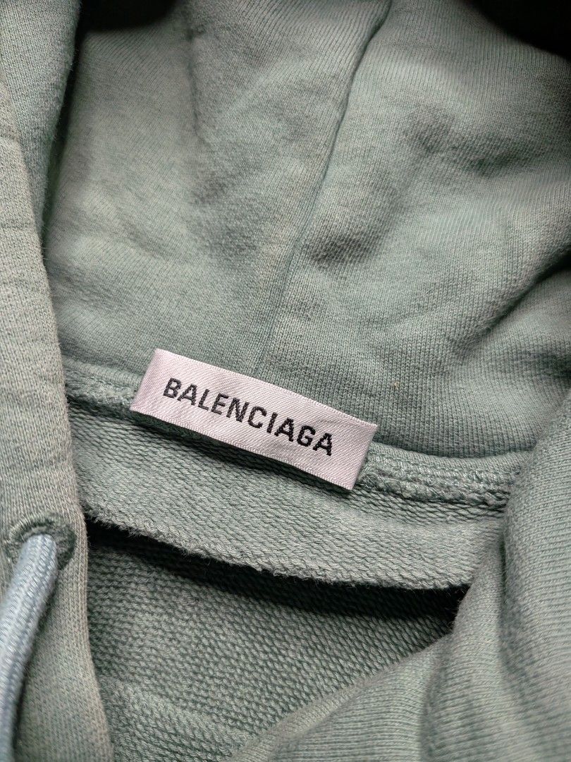 Balenciaga Script Hoodie (Category: Hoodies) located in Paniqui. Submitted by fndrs.kprs.ph (Listing ID 1461120229, Image 3). Description: Balenciaga Size on tag: XS 22x27 Color rate: 9/10 Good Condition No flaws.