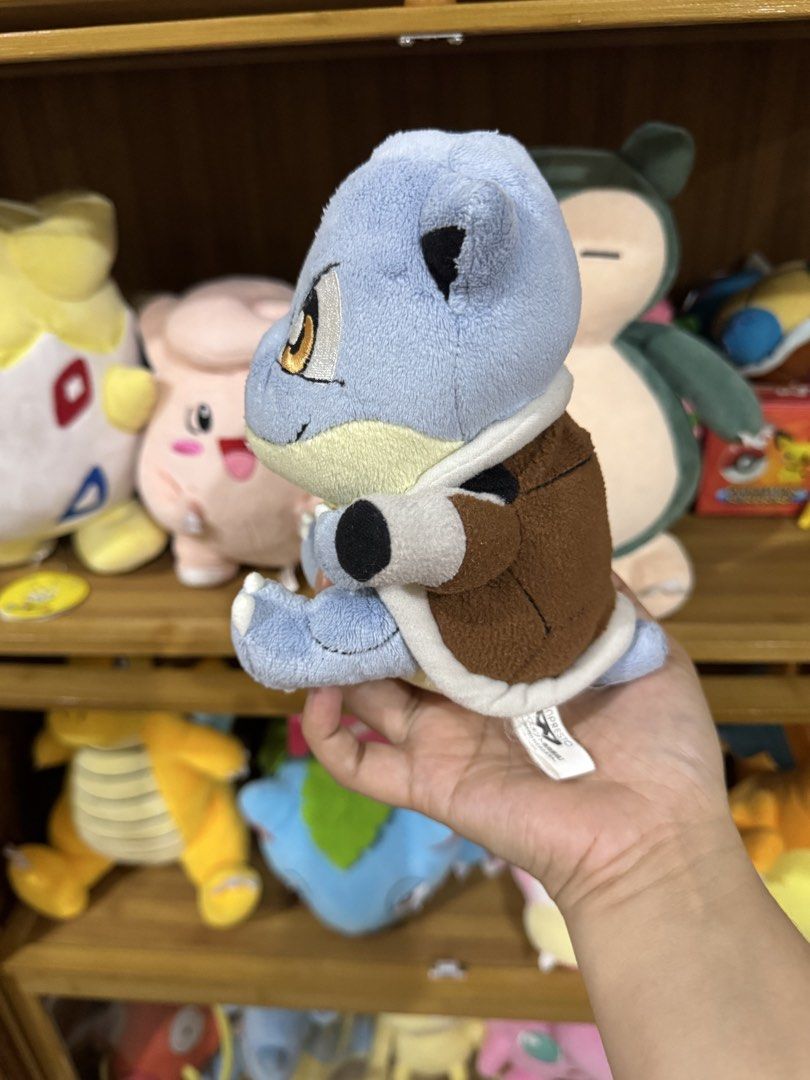 Banpresto Pokemon Blastoise Plush Toy (Category: Plushies & Soft Toys) located in Cainta. Submitted by mayhroeen (Listing ID 1461203828, Image 2). Description: - Authentic Banpresto Squirtle plush - Super cute and incredibly soft - Ideal for any Pokemon enthusiast - Features a distinct brown shell - Detailed, expressive eyes - Perfect for displaying or cuddling - Don't miss out on this adorable Squirtle!.