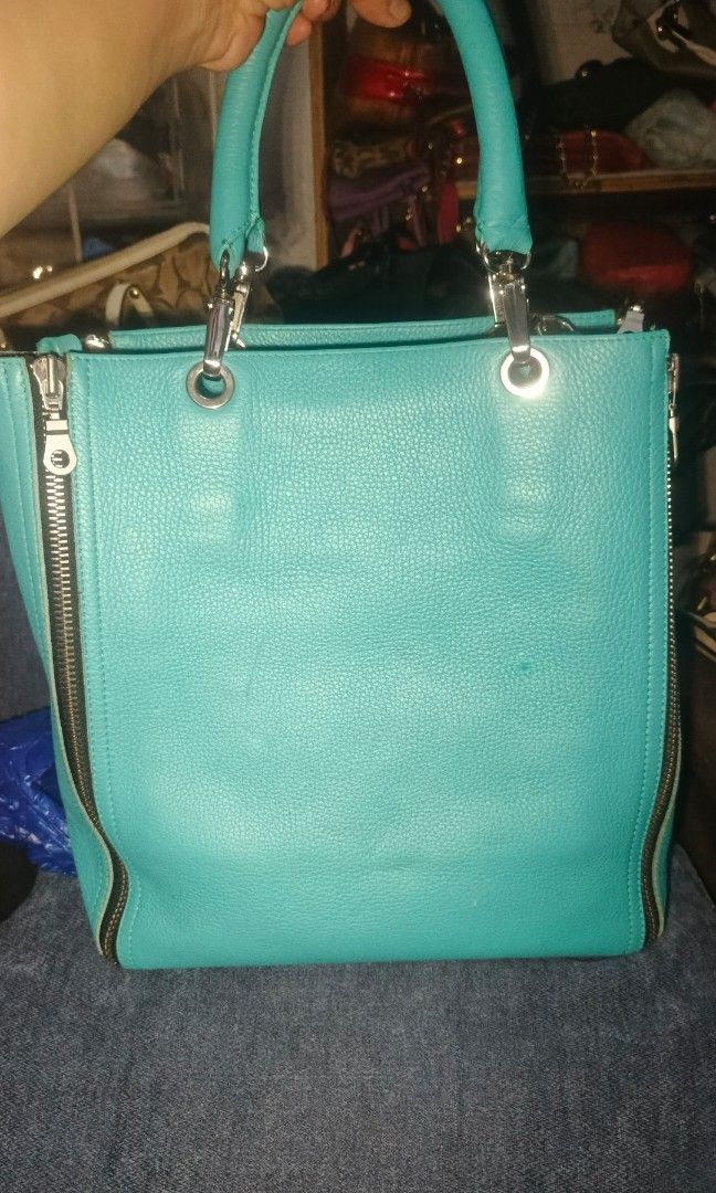 Barbara Rihl Paris (Category: Luxury Bags & Wallets) located in Urdaneta. Submitted by bernalyn25 (Listing ID 1461322599, Image 2). Description: -Barbara Rihl Paris -4-zip Ykk convertible leather tote -Vibrant turquoise/mint green pebbled leather -With signature travel inspired stamp illustration - Can be used as crossbody, shoulder or hand bag.