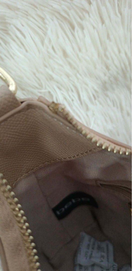 Bebe Shoulder Bag Taupe Leather (Category: Shoulder Bags) located in Manila. Submitted by marinellathenadurata (Listing ID 1461273662, Image 3). Description: - Cute taupe shoulder bag from Bebe - Textured leather material - Gold hardware details - Zipper closure - Comes with a detachable strap - Great for everyday use - Fits essentials -shoulder bag -used once -sling bag Loc san nicolas bulakan bulacan.