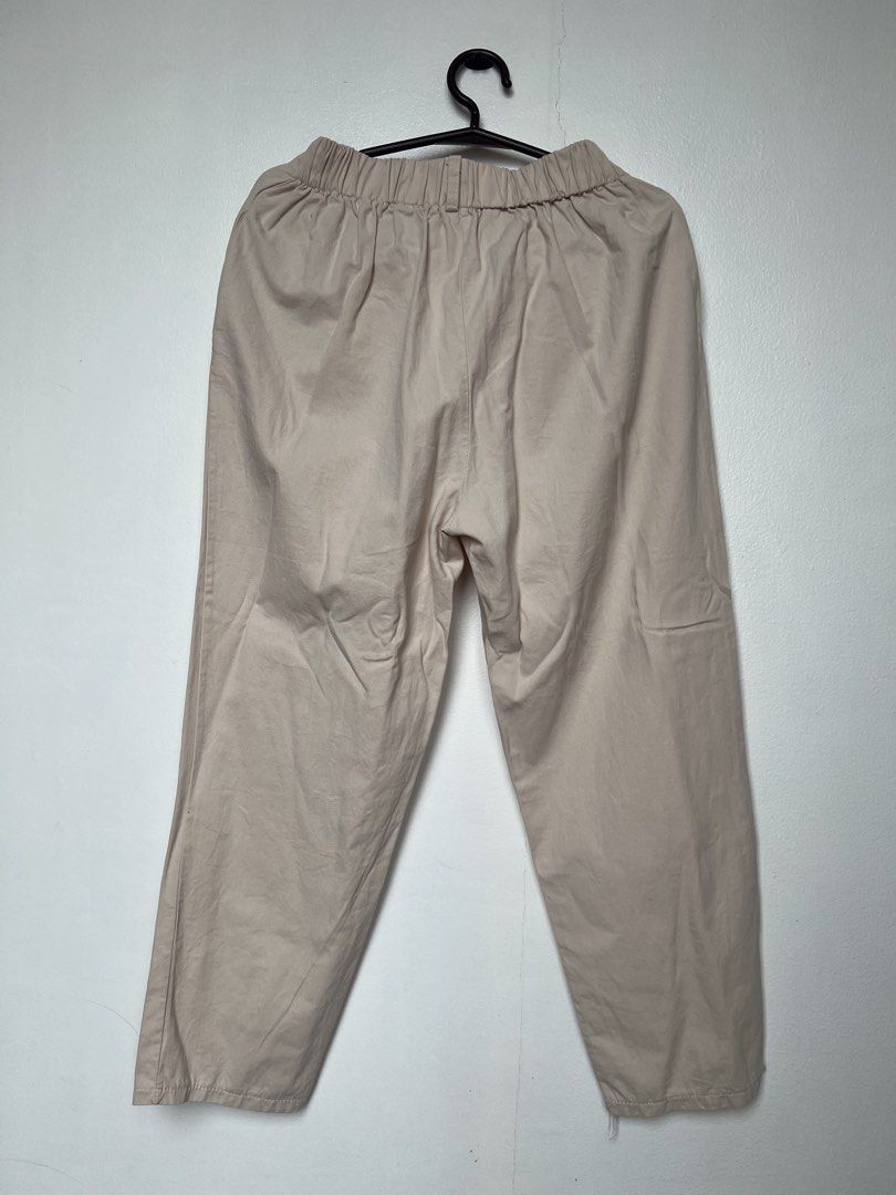 Beige Elastic Waist Baggy Pants (Category: Other Bottoms) located in Manila. Submitted by fasteasybuy (Listing ID 1461148788, Image 1). Description: - Comfortable beige pants - 2 pockets - Elastic waistband for easy fit - Classic straight leg cut - Soft, cotton-blend fabric feel - Ideal for casual wear - Versatile for pairing with various tops - Measurements available upon request.