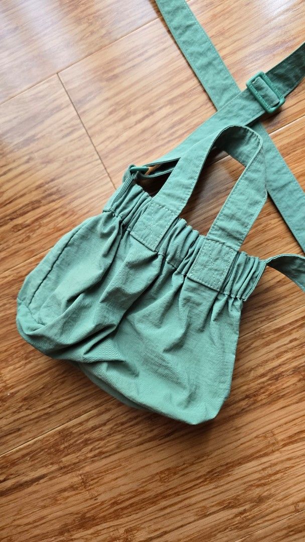 Beyond The Vines Micro Dumpling Bag (Category: Tote Bags) located in Paranaque City. Submitted by monicaher (Listing ID 1461118423, Image 2). Description: Beyond The Vines green tote bag. Adjustable straps, front snap pocket. Textured fabric, good for daily use..