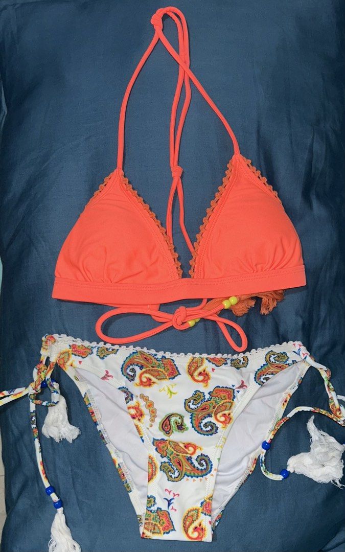 Bikini Set - Orange Top, Paisley Bottoms, Size Small (Category: Bikinis & Swimsuits) located in Palo. Submitted by kaleidoscope_676 (Listing ID 1461123665, Image 1). Description: - Adorable orange halter bikini top with intricate crochet trim and playful tassels. - Matching white bikini bottoms featuring a vibrant, colorful paisley print. - Both top and bottom are size Small (S). - Ideal for your next beach vacation or poolside lounging. - Get re
