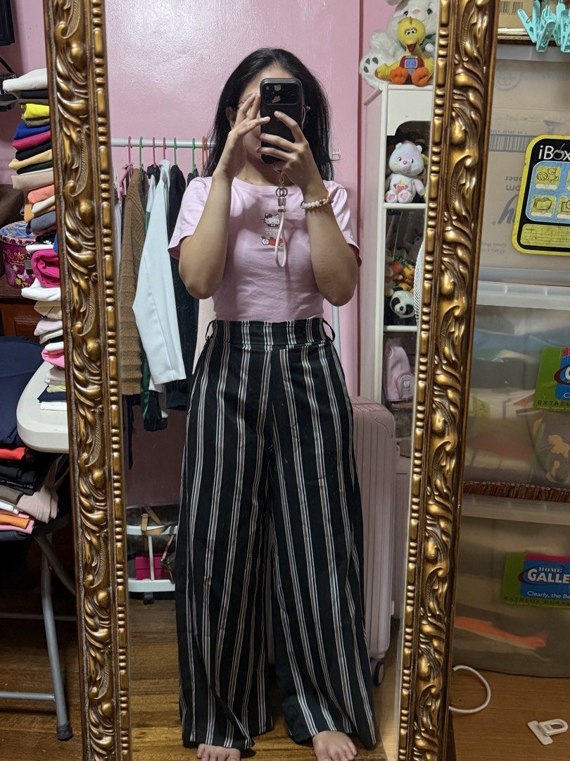 Black and White Striped Wide Leg Pants (Category: Other Bottoms) located in Manila. Submitted by mongosoleigh (Listing ID 1461263095, Image 1). Description: - High-waisted design - Bold black and white stripe pattern - Flowy wide-leg silhouette - Comfortable and stylish for casual wear - Versatile: easily pairs with simple tops - Creates a relaxed yet put-together look.