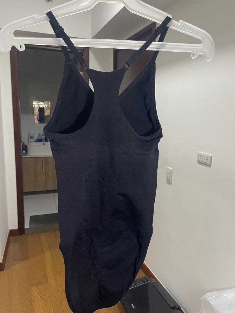 Black Bodysuit Tank Top with Adjustable Straps (Category: Sleeveless) located in Manila. Submitted by ellie_owl (Listing ID 1461222388, Image 1). Description: - Ribbed black bodysuit - Racerback design - Adjustable spaghetti straps - Snap closure at the bottom - Versatile for layering or wearing alone.