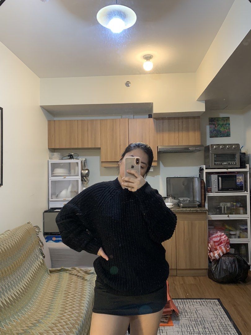 GU Black Chunky Knit Mock Neck Sweater (Category: Coats, Jackets and Outerwear) located in Makati City. Submitted by kaeswardrobe25 (Listing ID 1461286113, Image 1). Description: - Cozy black sweater - Chunky knit texture - Mock neck design for warmth - Long sleeves with a relaxed fit - Versatile for layering or wearing alone - Easy to style with jeans or skirts.