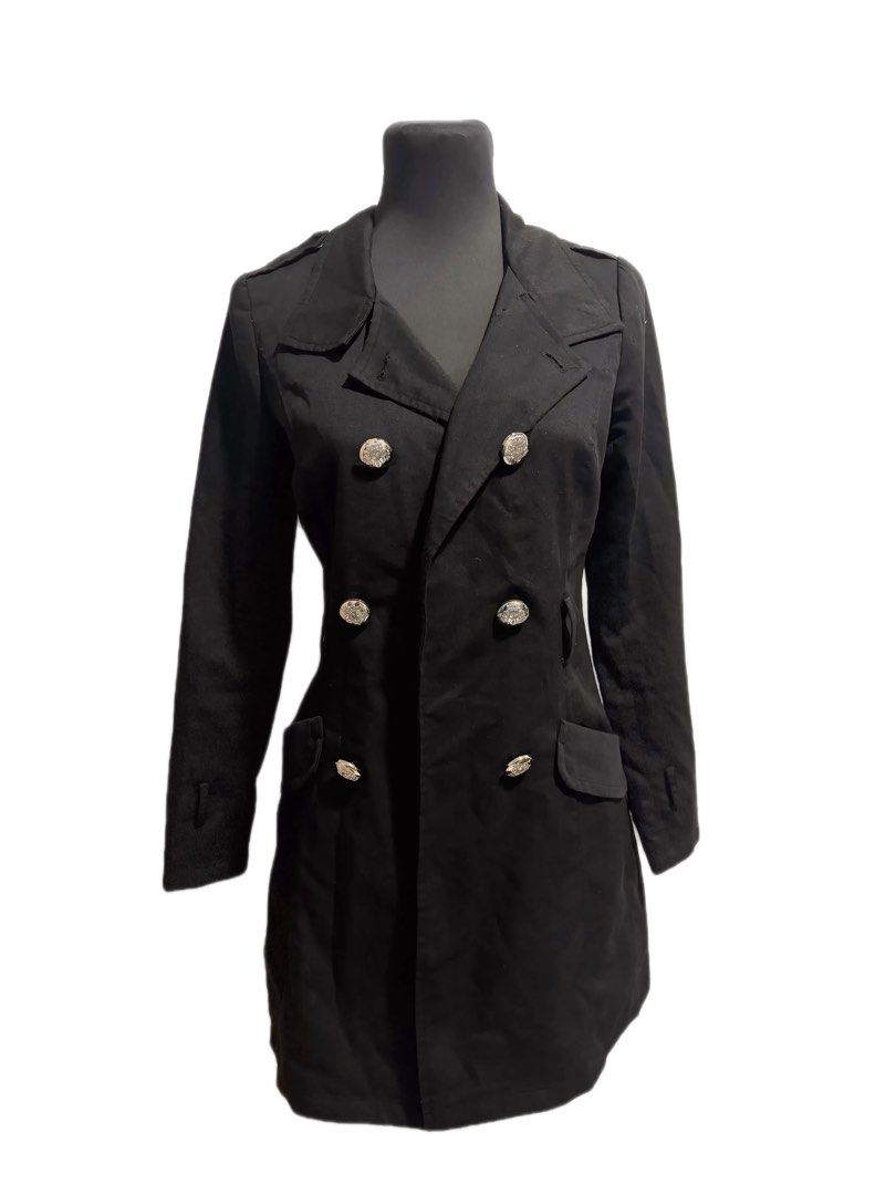 Black Double-Breasted Trench Coat with Silver Buttons (Category: Coats, Jackets and Outerwear) located in Trece Martires City. Submitted by raresen26 (Listing ID 1461314001, Image 1). Description: - Classic black trench coat - Double-breasted style with striking silver buttons - Structured collar and lapels - Two front pockets - Sharp and sophisticated look - Perfect for layering over any outfit - A versatile wardrobe essential.