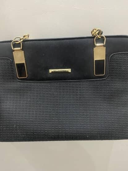 Black Handbag with Gold Hardware (Category: Luxury Bags & Wallets) located in Paranaque City. Submitted by Heyhey0125 (Listing ID 1461320355, Image 1). Description: - Stylish black handbag - Textured front panel - Elegant gold chain straps - Gold hardware details - Small metal logo plate accent - Immaculate interior - Versatile for everyday or evening wear.