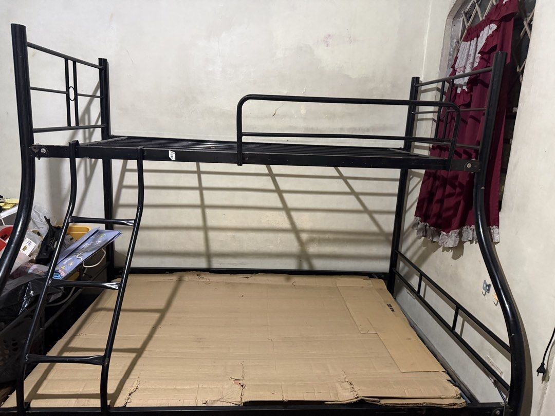 Black Metal Bunk Bed with Ladder (Category: Bed Frames & Mattresses) located in Manila. Submitted by the_magpie_burrow (Listing ID 1461245894, Image 2). Description: - Sturdy black metal bunk bed - Includes ladder for easy access - Great for saving bedroom space - Ready for a new home Used Sturdy Black Metal Twin-over-Full Bunk Bed with Ladder 36x75 (top) x 54x75 (bottom) metal twin-over-full double deck bed Note: Mattresses are not included. Buy