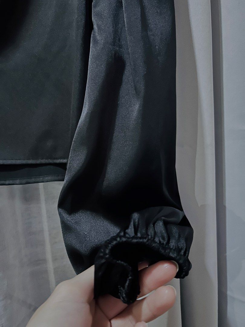 Black One Shoulder Satin Asymmetrical Top (Category: Longsleeves) located in Cainta. Submitted by unboxingstuff (Listing ID 1461285613, Image 2). Description: - Elegant black satin top; high quality - Asymmetrical one-shoulder design - Features a long puff sleeve with elastic cuff - Beautiful fabric sheen - Versatile for dressing up or down - Approximately 16 inches in length (shoulder to hem) - Can fit up to Large.