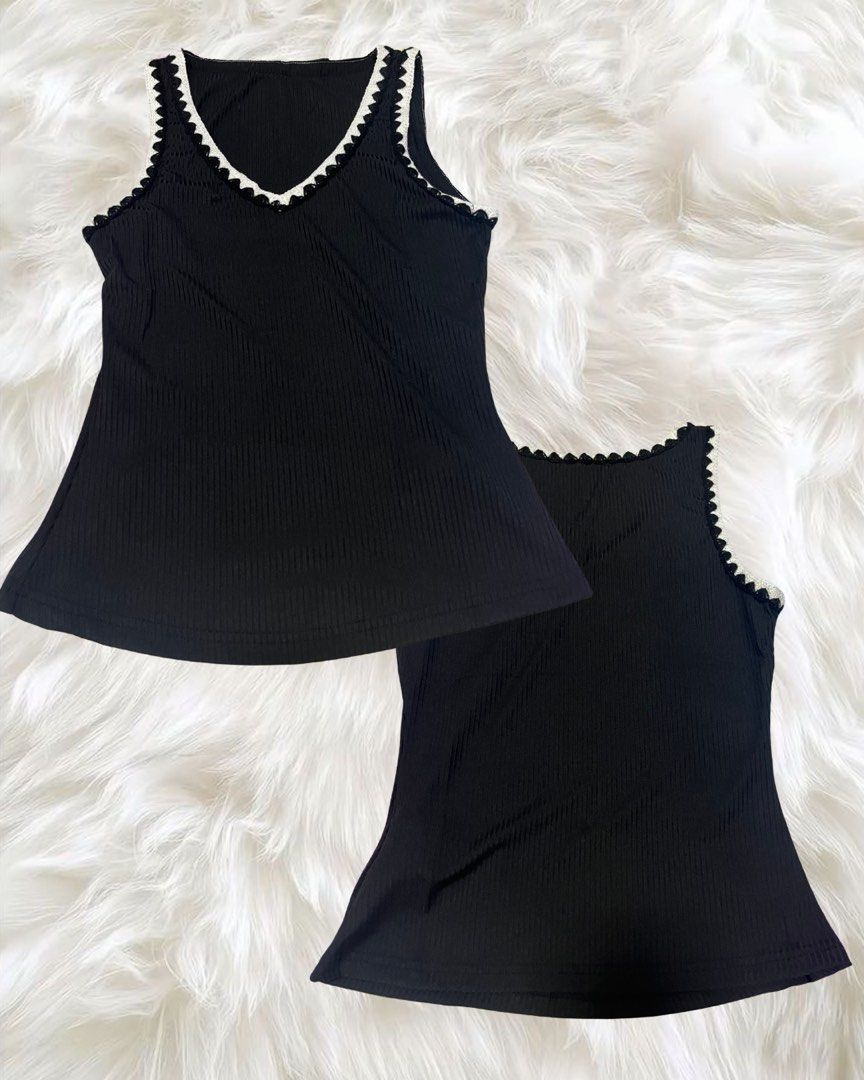 Black ribbed tank top with white trim (Category: Sleeveless) located in Manila. Submitted by love_by_sash (Listing ID 1461293123, Image 1). Description: - Cute black ribbed tank top - V-neck with white scalloped trim - Slightly flared hem - Comfortable and stretchy material - Perfect for layering or wearing solo.
