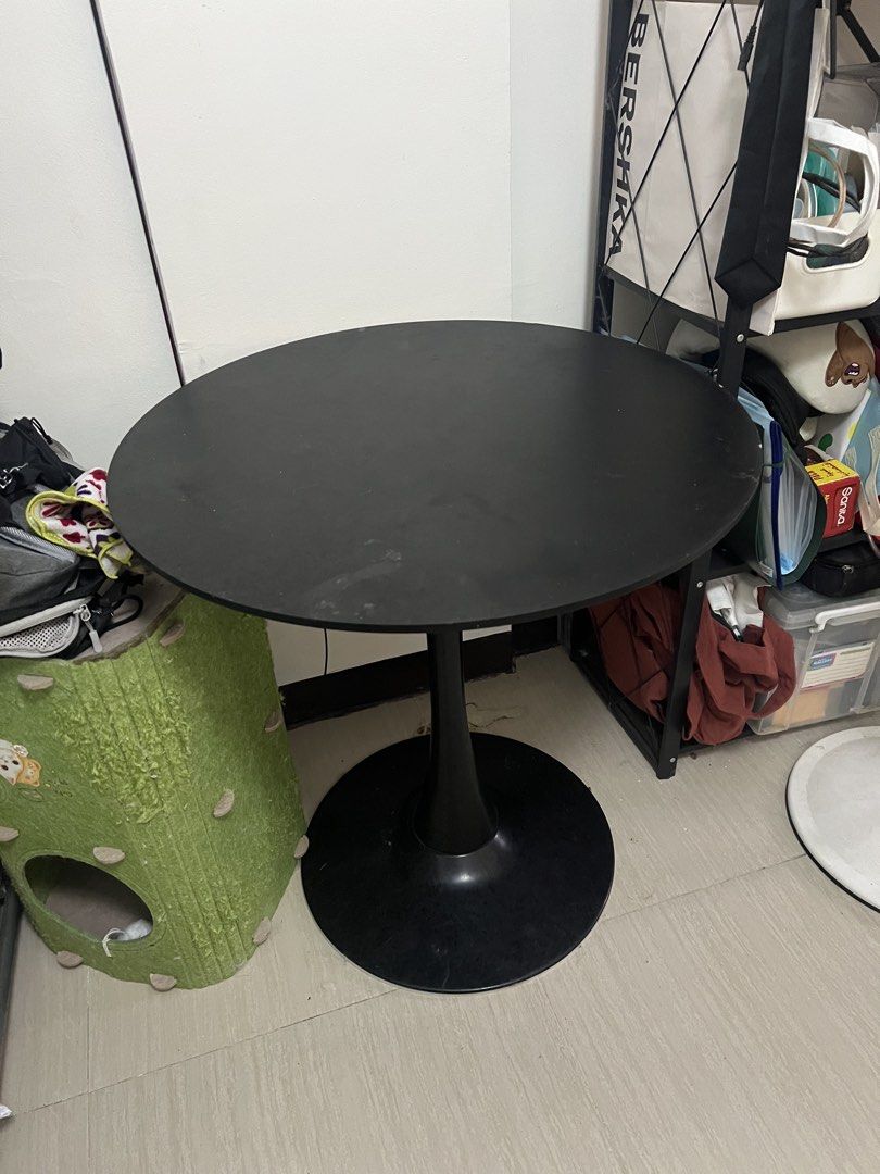 Black Round Tulip Style Dining Table (Category: Tables & Sets) located in Manila. Submitted by magnuscastle (Listing ID 1461226011, Image 1). Description: - Black round dining table - Elegant tulip base design - Ideal for small spaces or as a side table - Sturdy and stable construction - Minor scuffs on surface from normal use - Selling because of redecoration - Pick up only.