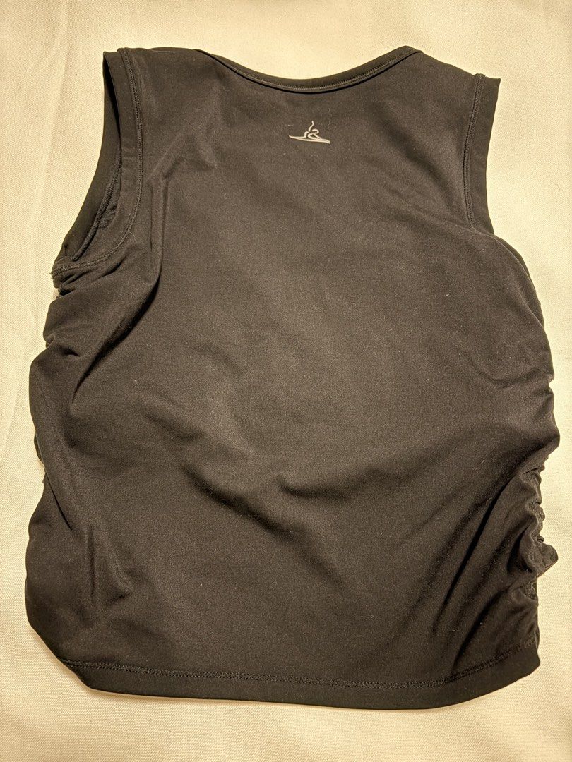 Black Ruched Tank Top Athletic Top (Category: Sleeveless) located in Mandaluyong City. Submitted by sarisaringtinda (Listing ID 1461138175, Image 3). Description: Small to Medium, makapal tela - Black athletic tank top - Sleeveless design - Ruched sides for a flattering fit - Stretchy material for comfort and flexibility - Perfect for workouts or casual everyday wear - Simple and versatile addition to your wardrobe.