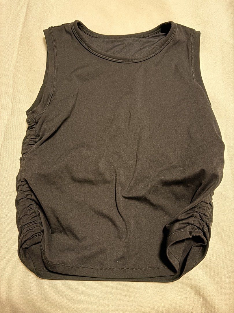 Black Ruched Tank Top Athletic Top (Category: Sleeveless) located in Mandaluyong City. Submitted by sarisaringtinda (Listing ID 1461138175, Image 1). Description: Small to Medium, makapal tela - Black athletic tank top - Sleeveless design - Ruched sides for a flattering fit - Stretchy material for comfort and flexibility - Perfect for workouts or casual everyday wear - Simple and versatile addition to your wardrobe.