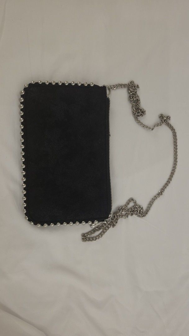 Black Suede Studded Clutch Bag with Silver Chain Strap (Category: Clutches) located in Mandaluyong City. Submitted by mysharecloset (Listing ID 1461304960, Image 1). Description: - Black suede clutch bag - Studded detail around the edges - Detachable silver chain strap - Secure zipper closure - Multiple interior compartments - Interior zippered pocket - Ideal for nights out and events.