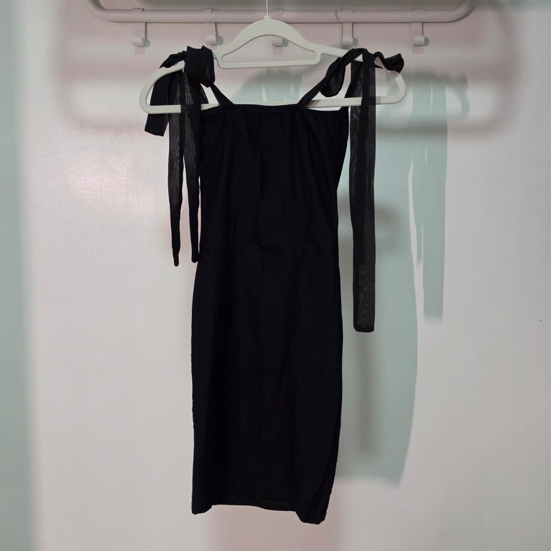 Black Tie Shoulder Mini Dress (Category: Dresses) located in Mandaluyong City. Submitted by Llyssa12 (Listing ID 1461252154, Image 2). Description: - Black mini dress - Tie shoulder straps - Slight sheen fabric - Fitted style - Ideal for night outs or parties - Simple and chic design - Only worn once - Fits Small -Shipping is shouldered by the buyer.