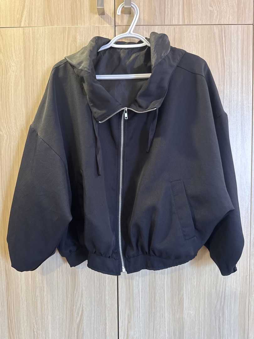Black Zip-Up Bomber Jacket with Drawstring Hood (Category: Coats, Jackets and Outerwear) located in Bacolod City. Submitted by bellabianca_closet (Listing ID 1461116898, Image 1). Description: Best fit L-XL Oversized - Lightweight black bomber jacket - Zip-up front closure - Drawstring hood for adjustable coverage - Elasticated cuffs and hem for a snug fit - Two convenient side pockets - Ideal for casual outfits or as a layering piece.