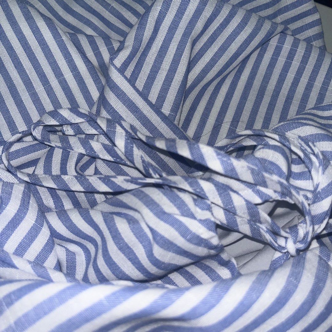 Blue & White Striped Camisole Top (Category: Sleeveless) located in Makati City. Submitted by midnightmelhem (Listing ID 1461140152, Image 3). Description: - Cute blue and white striped camisole top from SHEIN. - Features adjustable spaghetti straps. - Stylish tie-back detail with a cutout. - Flattering front pleating. - Lightweight fabric, ideal for warm weather. - Versatile piece, pairs well with shorts or skirts..
